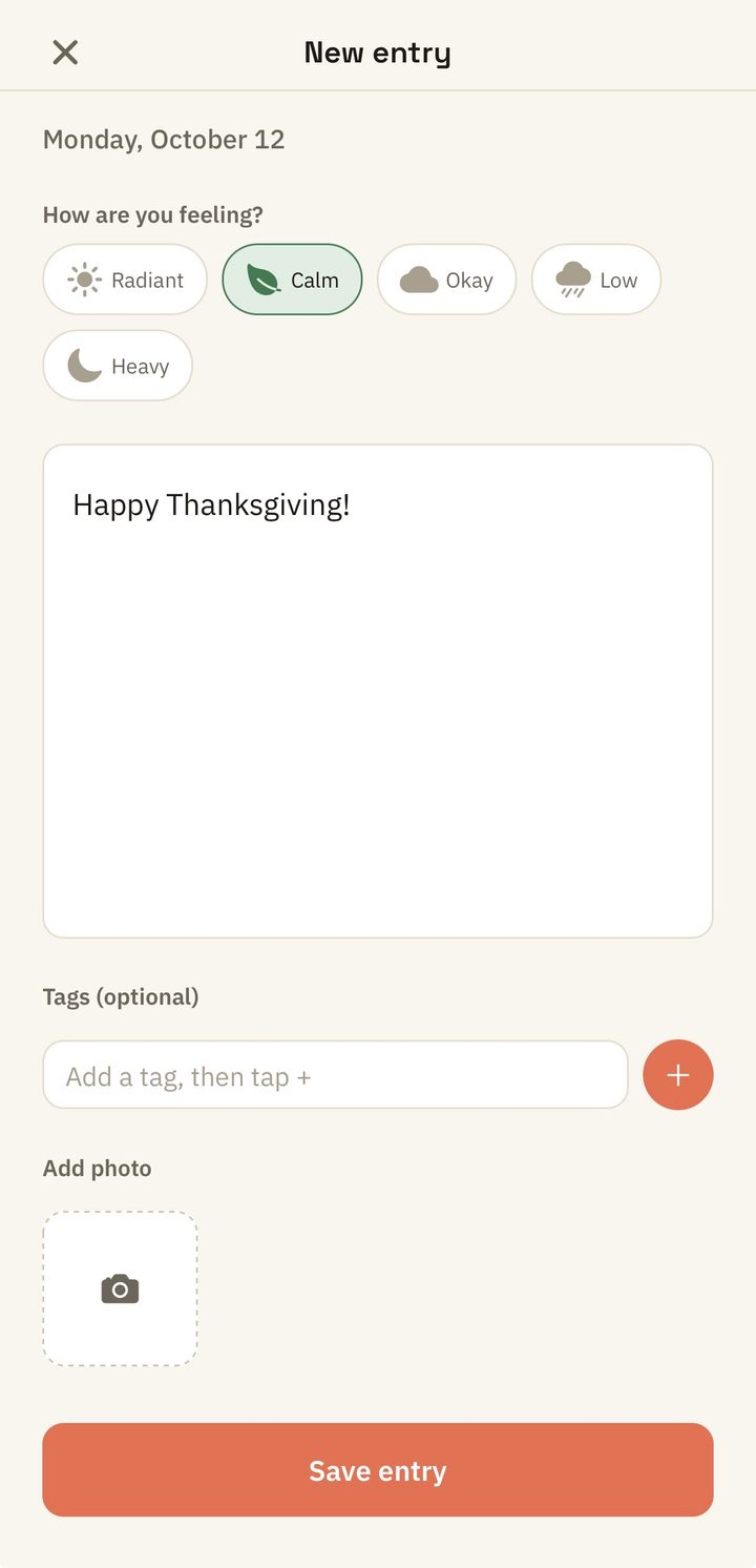 Yuktisa Journal new entry screen: a mood picker with Radiant, Calm, Okay, Low, and Heavy, a writing area, optional tags, and an add-photo button